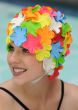 Woman in multicolored old fashioned style floral swimming cap with chin strap