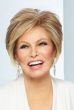 Raquel Welch in a chin length light auburn stacked bob wig with side bangs