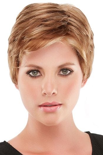 Woman in blonde, short pixie wig with layers and bangs
