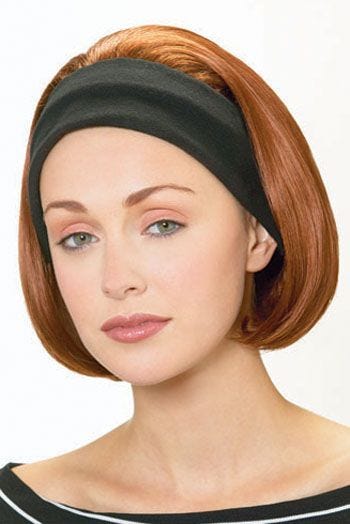 Woman in auburn bob cut wig with black headband attached