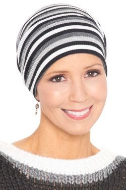 Woman in striped ribbed beanie chemo cap