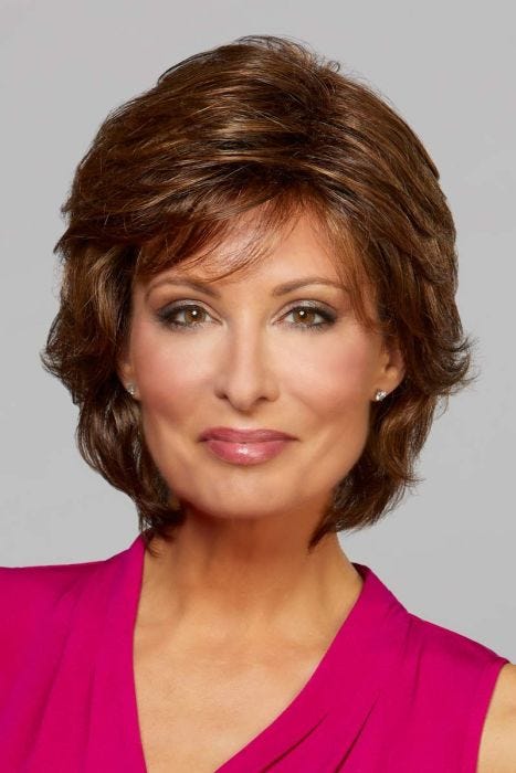 Woman in a past the chin dark auburn layered bob wig with layers throughout and wispy bangs