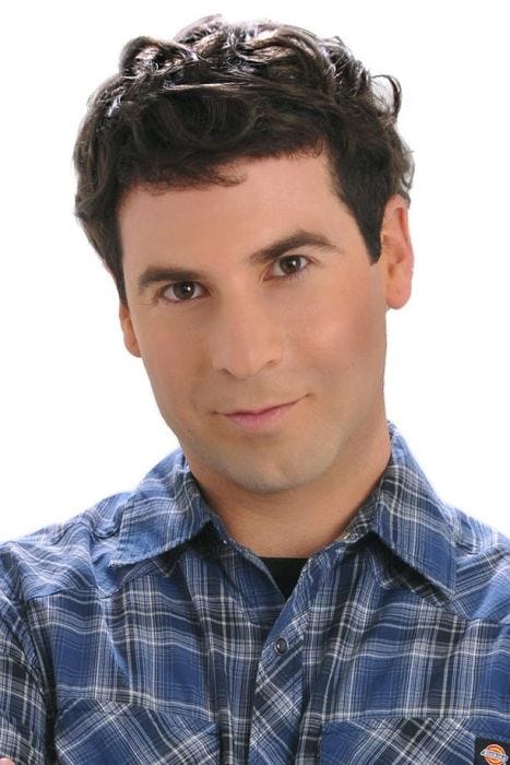 Man in a short dark brown human hair men's topper for thinning hair