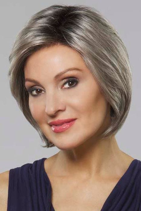 Woman in a chin length straight grey bob wig
