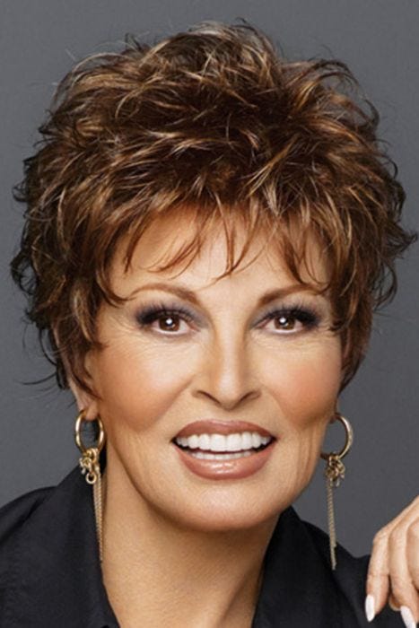Raquel Welch in short curly wig with bangs and layers
