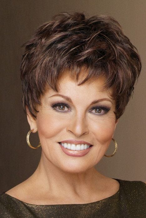 Woman in a short, semi-wavy pixie wig with short textured bangs