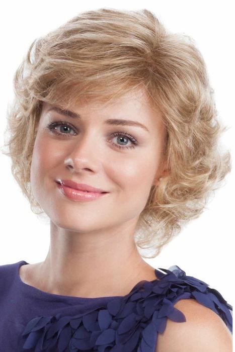 Woman in a past the chin light blonde curly wig with side bangs