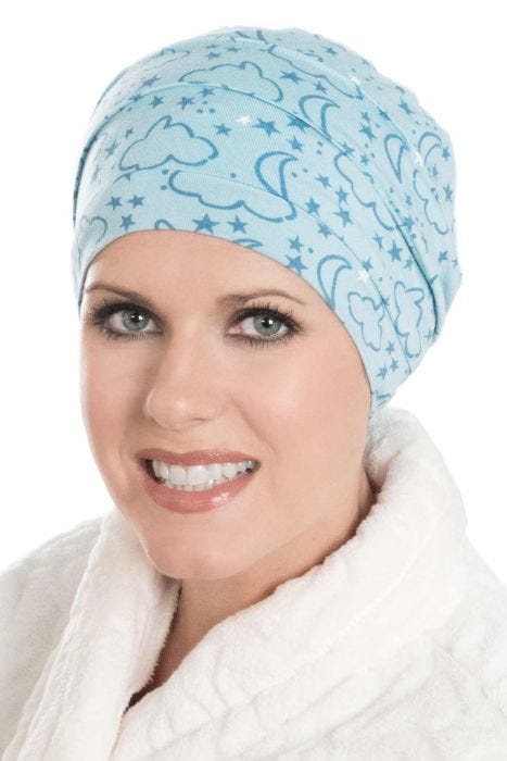 Woman in blue moon and stars print bamboo sleeping cap for women with cancer