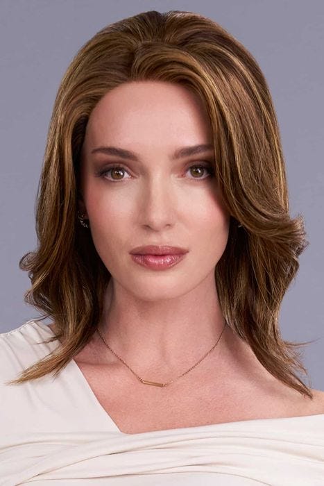 Woman in a shoulder length dark auburn curly human hair wig