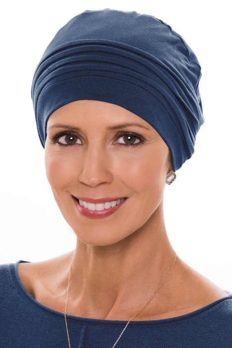 Woman in navy bamboo chemo cap