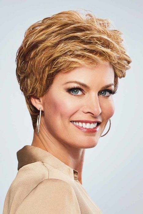 Woman in a warm blonde pixie wig with longer hair on the top and sides