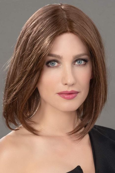 Woman in a 12.5" straight medium auburn human hair topper for thinning hair