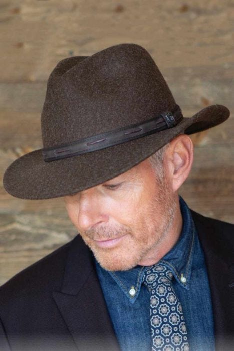 Older man in brown winter wool felt outdoor brimmed men's safari hat