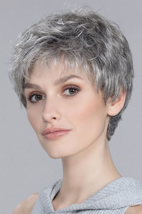 Short textured pixie wig with soft volume, wispy bangs, and tapered nape