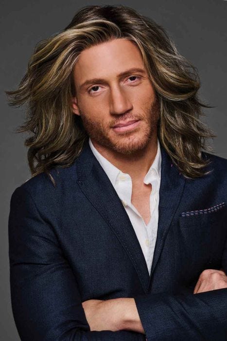 Man in a shoulder length layered medium brown lace front wig