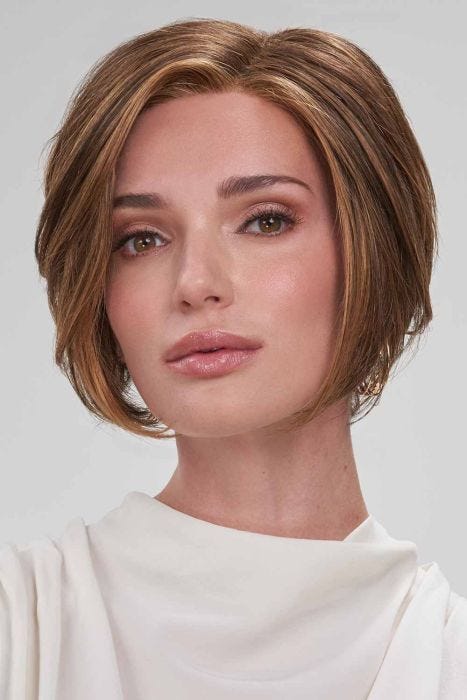 Woman in a chin length angled medium auburn lace front wig