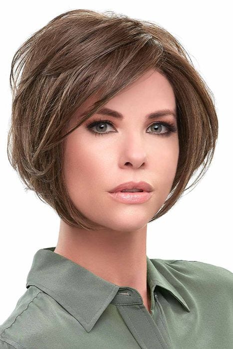 Woman in a large chin length medium brown angled lace front wig