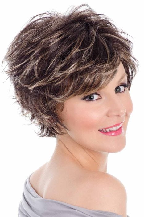 Woman in a dark brown tousled layered short wig with side bangs