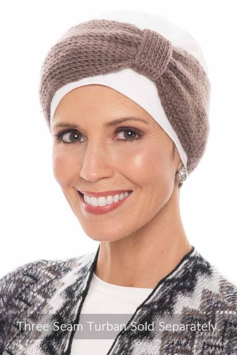 Woman in a white Three Seam Turban with a taupe knit bow headband on top