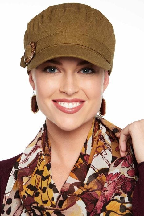 Women in olive brimmed linen cadet hat for cancer patients
