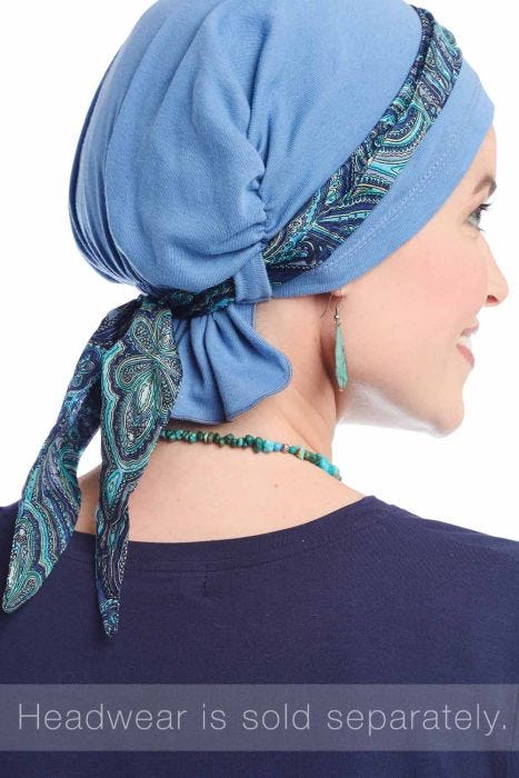 Woman in blue head covering featuring mini scarf that can be tied onto multiple hats turbans and scarves to accessorize them