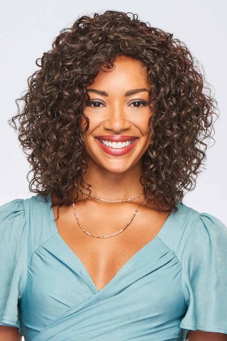 Medium curly wig with defined spiral curls and shoulder-length layers, styled with natural volume and shine