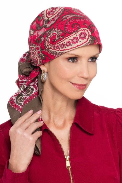 Woman in red hand stamped pre tied head scarf for cancer patients