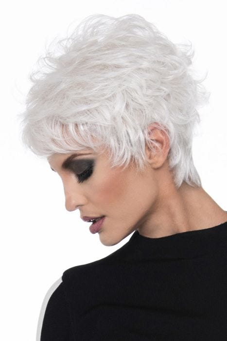 Woman in a messy, choppy layered white human hair wig with side bangs