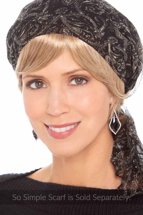Woman in a short straight blonde halo wig under a black head scarf