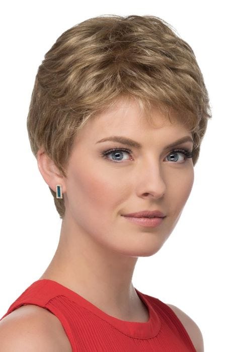 Woman in a petite short layered dark blonde pixie wig
