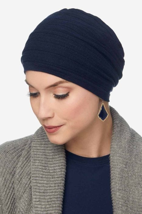 Woman in navy ribbed cotton chemo beanie hat