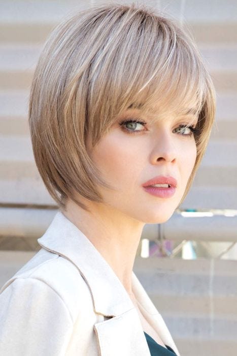 Woman in blonde, short, straight chin length bob wig with layers