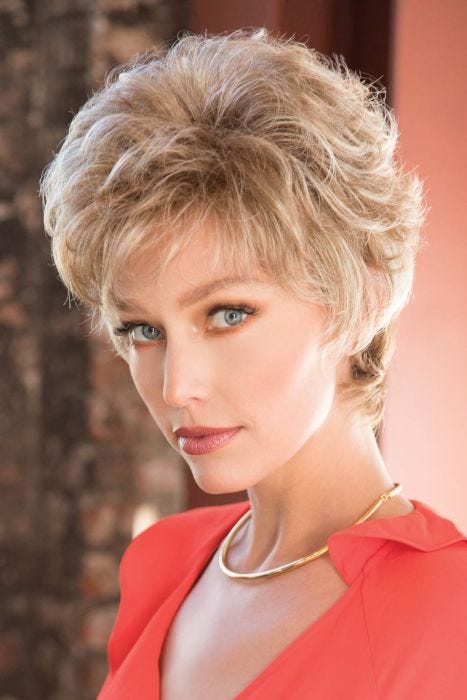 Woman in short curly blonde wig for older women