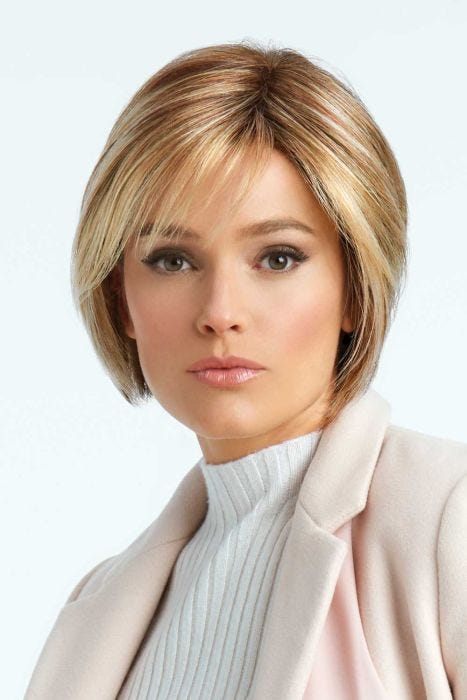 Woman in a chin length light auburn layered lace front rounded bob wig with side bangs