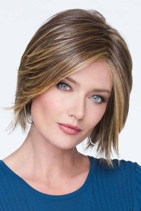 Woman in a chin length light brown angled lace front bob wig