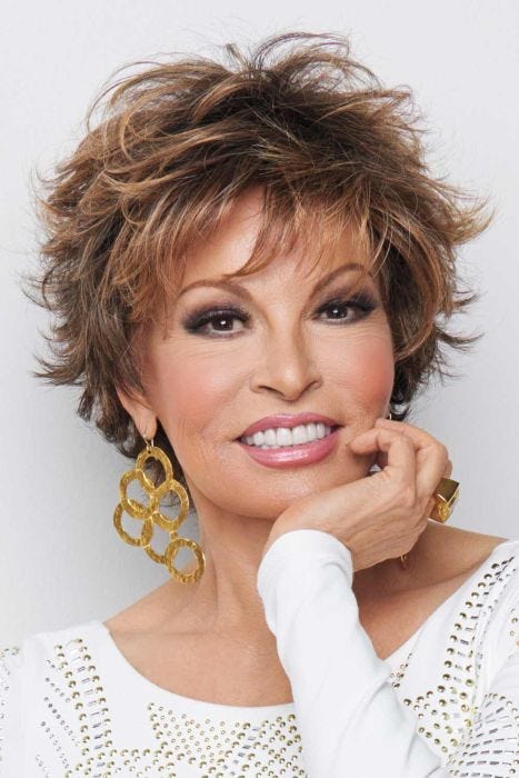Raquel Welch in a tousled medium auburn pixie wig with fringe bangs