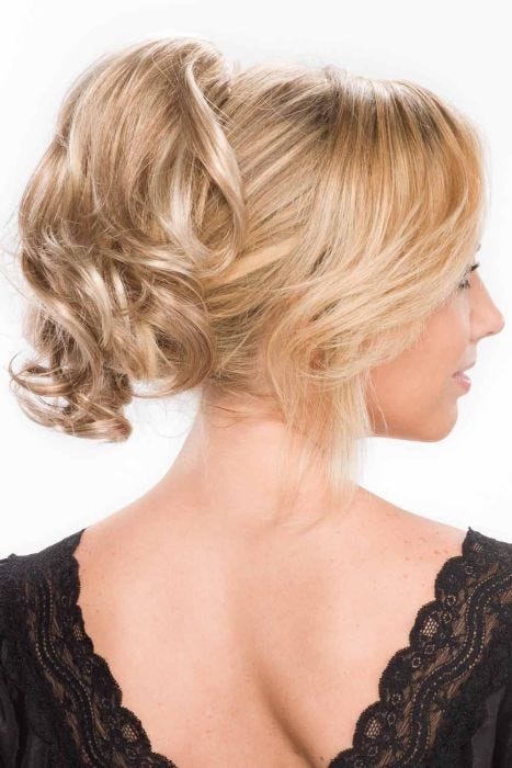 Woman in a curly light blonde clip in updo hairpiece