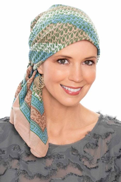 Woman in khaki swirled head scarf for women with cancer