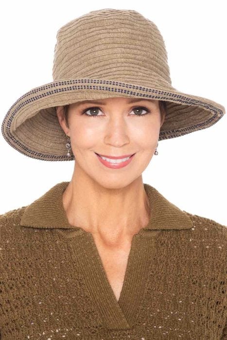 Woman in brown fall and winter chenille bucket hat with large upturned brim