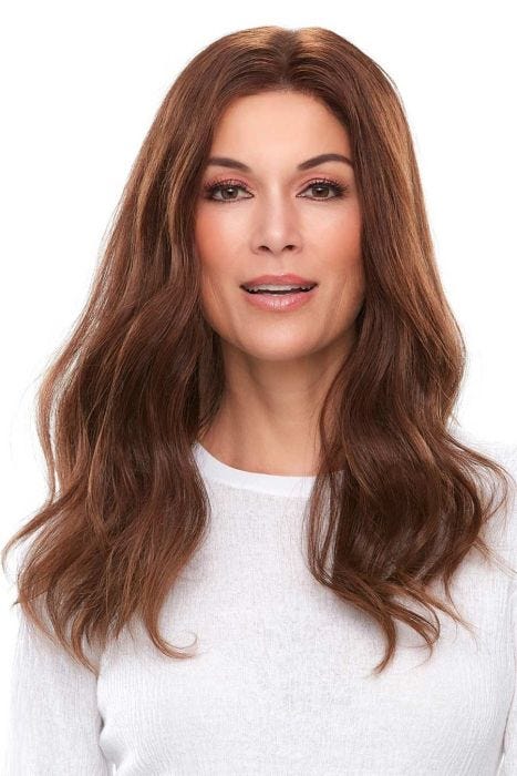 Woman in 18" wavy medium auburn lace front hair topper for thinning hair