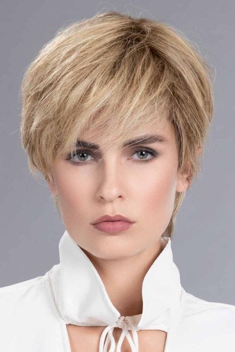 Woman in a 5" to 6" warm blonde wiglet hair topper for thinning hair