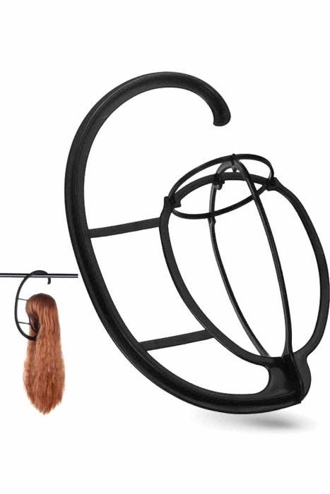 Hanging wig stand shown hanging on a clothes rack