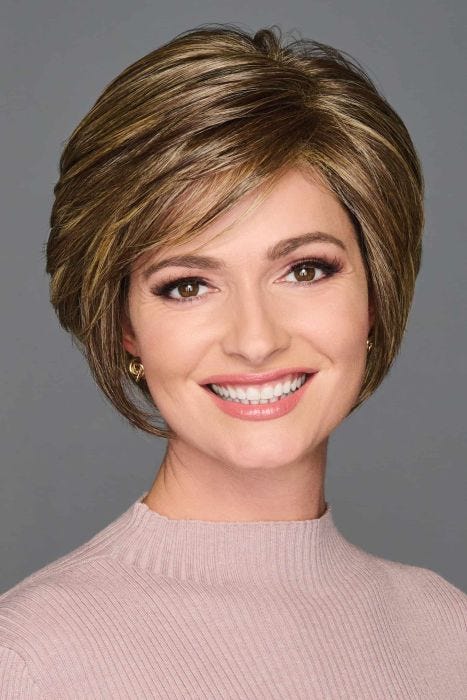 Woman wearing short layered bob wig with side-swept bangs and highlighted brown tones, soft volume and natural shape