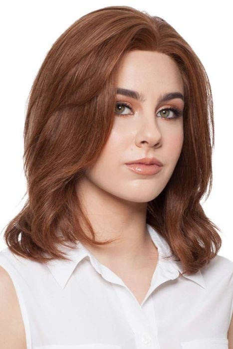 Woman in a shoulder length dark auburn human hair wig