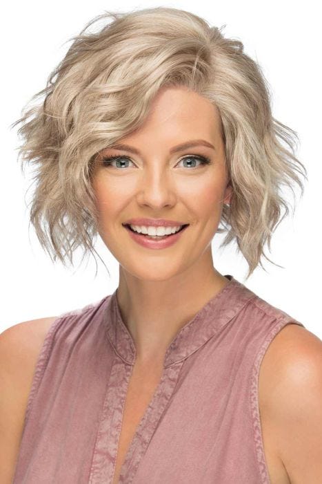 Woman in a chin length stacked curly blonde lace front wig